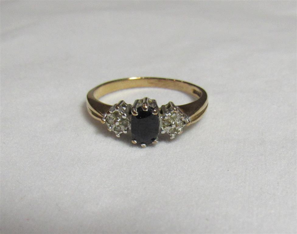 A 9ct gold, sapphire and diamond accent dress ring with faded markings. Ring size O, weight 2.3g.