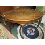 A large oak corner table