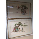 A pair of embroidered silks of peacocks and of oriental design in gilt bamboo effect frames