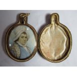 Memorial jewellery - A cased large oval memorial reverse pendant with a portrait miniature to one