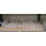 A large collection of crystal glasses including a Queen Mother 80th celebratory glass, two vases and