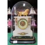 A white alabaster clock on a wooden base with gilt decoration and a gilt lion to the top, all