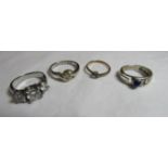 Four stone set dress rings in rolled gold, 925 silver or white metal. Ring sizes K 1/2, N, P 1/2 and