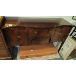 A mahogany bow fronted sideboard with two side cupboards and two central drawers and with round drop