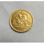 A 1906 half gold Sovereign.