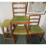 Three kitchen dining chairs and a stool all upholstered in green self tapestry fabric