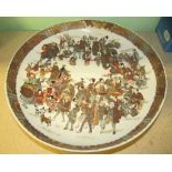 A 19th century Satsuma earthenware shallow bowl decorated with market traders and their customers