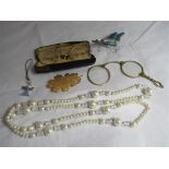 A pair of cased vintage ladies unmarked gold (tested) rimmed magnifiers/pince-nez spectacles.