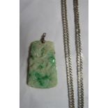 A carved jadeite pendant piece, length 6cm, weight 38g, together with a silver curb chain