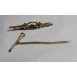 A marked 9ct gold open work bar brooch set with a green stone together with a rose gold or gilt