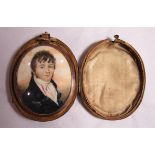 Memorial jewellery - A cased large oval memorial reverse pendant with a portrait miniature to one
