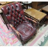 A nest of three tables, one long and two under side by side all with glass tops and with carved legs