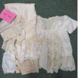 A small collection of late 19th/early 20th century babies/childs silk and lace clothing to include a