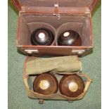 A pair of bowling woods in canvas carrying case together with another pair in leather case