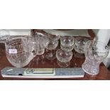 An Art Deco barrell water jug with 4 glasses, 2 champagne and glass dessert dishes and a crystal