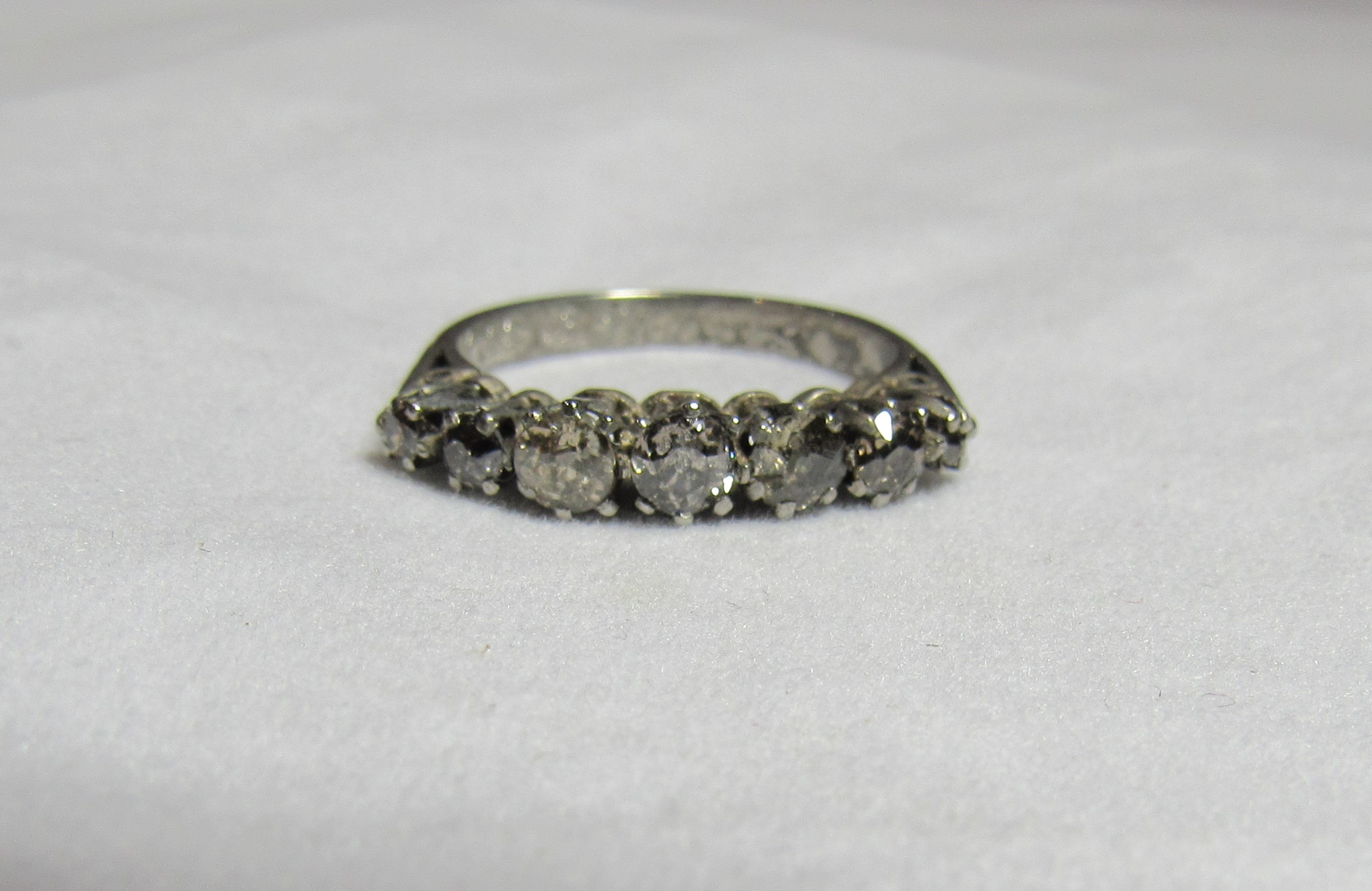 A vintage platinum and graduated seven stone diamond dress ring, marked Plat and inscripted 22/12/51 - Image 3 of 3