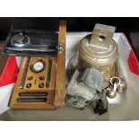 Two cased measuring instruments, a brass bell and a paraffin bicycle lamp