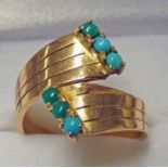 TURQUOISE SET DRESS RING Condition Report: Ring size: O, unmarked yellow metal.