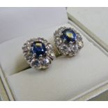 PAIR OF SAPPHIRE & DIAMOND CLUSTER EARRINGS THE OVAL SAPPHIRE WITH A SURROUND OF 8 BRILLIANT-CUT
