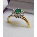 18CT GOLD OVAL EMERALD & DIAMOND SET RING Condition Report: Ring size: R.