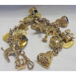 9CT GOLD CHARM BRACELET WITH 1913 HALF SOVEREIGN & 1854 AMERICAN ONE DOLLAR TOTAL WEIGHT 61 GRAMS