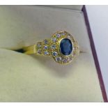 18CT GOLD SAPPHIRE & DIAMOND CLUSTER RING Condition Report: Ring size: M. Weight: 3.