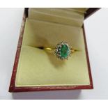 18CT GOLD EMERALD & DIAMOND CLUSTER RING Condition Report: Ring size: O.