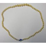 CULTURED PEARL NECKLACE OF APPROXIMATELY 68 PEARLS ON CLASP MARKED SILVER