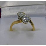 18 CT GOLD 2 - STONE TWIST DIAMOND SET RING,