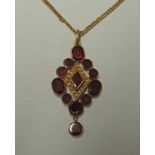 GARNET & PEARL SET PENDANT MARKED 9KT ON FINE CHAIN MARKED 18 5.