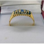 18CT GOLD SAPPHIRE & DIAMOND SET RING.