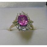 PINK SAPPHIRE AND DIAMOND CLUSTER RING.
