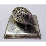 EDWARDIAN SILVER HEDGEHOG PIN CUSHION ON SQUARE BASE,