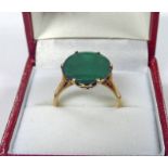 OVAL GREEN STONE RING IN SETTING MARKED 9K