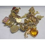 9CT GOLD CHARM BRACELET WITH 1909 HALF SOVEREIGN AND OTHER CHARMS 81 GMS TOTAL