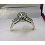 DIAMOND SOLITAIRE RING. THE CENTRALLY SET DIAMOND OF APPROX.