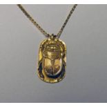 OVAL YELLOW METAL SCARAB,