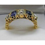 5 STONE DIAMOND AND SAPPHIRE SET RING WITH DIAMOND POINTS MARKED 18CT Condition Report:
