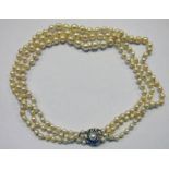 TRIPLE STRAND CULTURED PEARL NECKLACE ON CLASP MARKED 750
