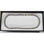 CULTURED PEARL NECKLACE WITH DARK COLOURING ON CLASP MARKED 925 WITH 56 PEARLS,