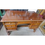 EARLY 20TH CENTURY WALNUT DESK WITH 7 DRAWERS AND TUR50NED SUPPORTS