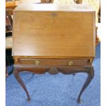 EARLY 20TH CENTURY MAHOGANY BUREAU WITH SHAPED INTERIOR ON SHAPED SUPPORTS