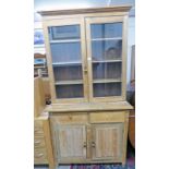 PINE BOOKCASE WITH 2 GLAZED DOORS OVER 2 DRAWERS OVER 2 PANEL DOORS