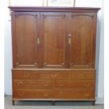 20TH CENTURY CONTINENTAL BEECH WARDROBE WITH 3 PANEL DOORS OVER 7 DRAWERS ON TURNED SUPPORTS 212 CM