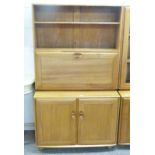 TEAK ERCOL CABINET WITH FALL FRONT OPENING TO FITTED INTERIOR OVER 2 PANEL DOORS