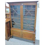 EARLY 20TH CENTURY INLAID MAHOGANY BOOKCASE WITH 2 ASTRAGAL GLAZED DOORS OVER 2 PANEL DOORS ON