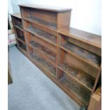 20TH CENTURY MAHOGANY LOW BREAKFRONT OPEN BOOKCASE ON PLINTH BASE 124CM TALL