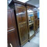 EARLY 20TH CENTURY MAHOGANY TRIPLE MIRROR WARDROBE WITH FITTED INTERIOR ON PAW FEET