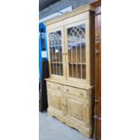 PINE BOOKCASE WITH 2 GLAZED DOORS OVER 2 DRAWERS OVER 2 PANEL DOORS 197CM TALL