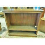 LATE 19TH CENTURY OAK OPEN BOOKCASE ON PLINTH BASE